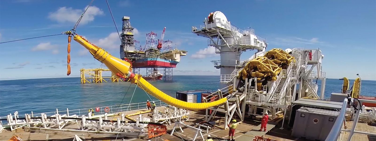 Cable laying vessel NKT Victoria installing an offshore cable with platform Martin Linge in the background