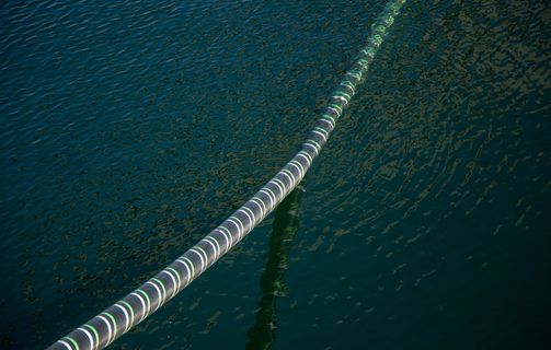 Cable Hanging Over Sea Water