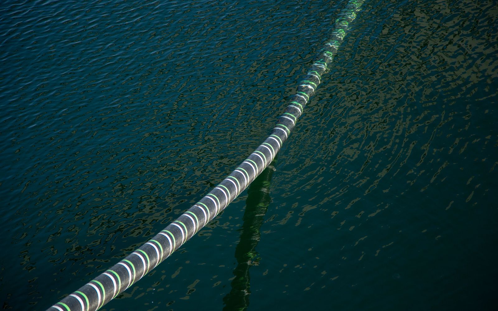 Cable Hanging Over Sea Water